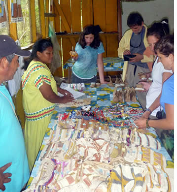 Tourist buying ornaments and chocolate from the Ngobe Indigenous in Bocas del Toro, Panama
